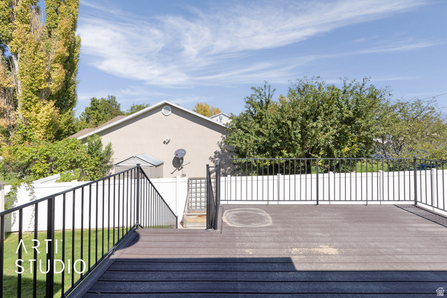 704 West Vahe Street Draper, UT 84020 - Photo 25 of 35 Spacious composite deck featuring dark-toned decking and black metal railings
