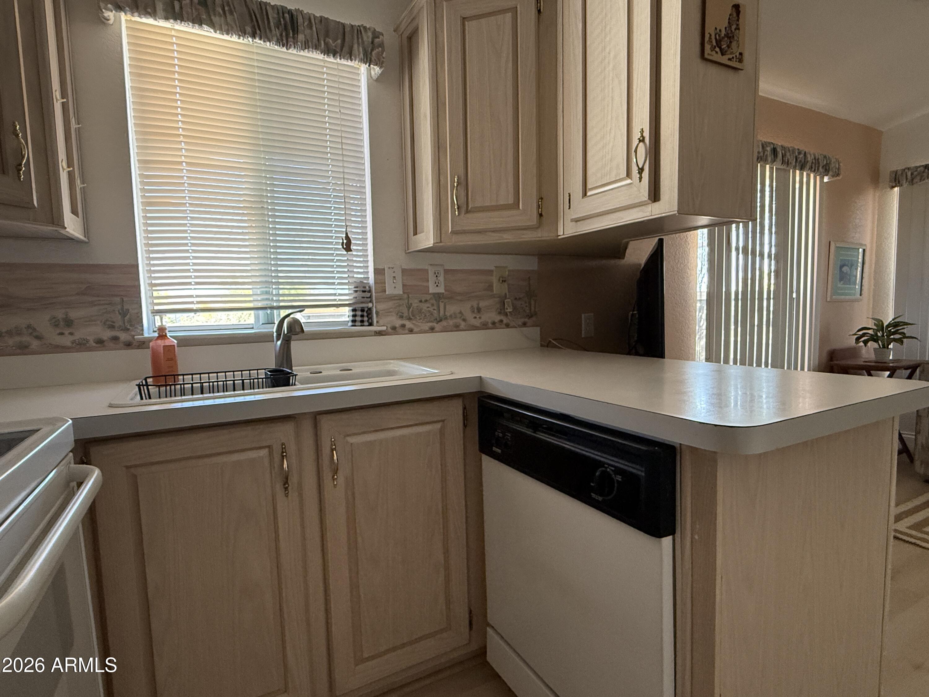 21340 Trading Post Trail Congress, AZ 85332 - Photo 7 of 31 a kitchen with stainless steel appliances granite countertop a sink stove and cabinets
