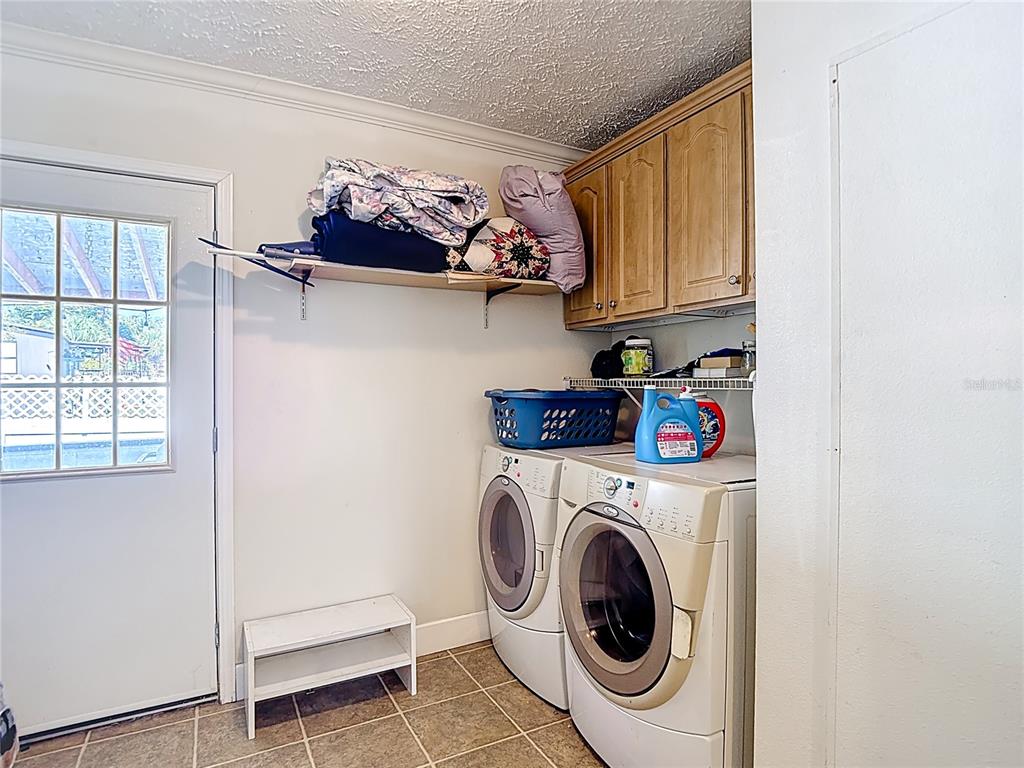 15821 Archer Street Hudson, FL 34667 - Photo 57 of 77 a utility room with dryer and washer