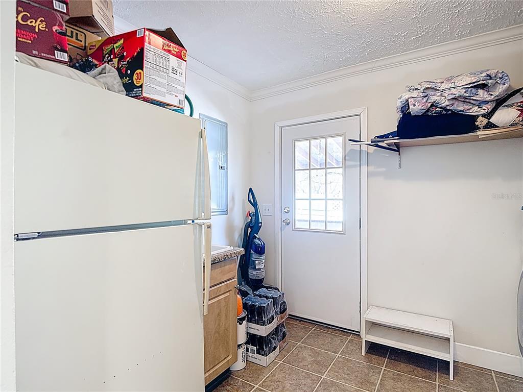 15821 Archer Street Hudson, FL 34667 - Photo 58 of 77 a view of a workspace with furniture and a window