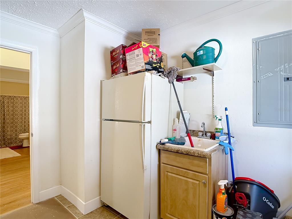15821 Archer Street Hudson, FL 34667 - Photo 59 of 77 a view of a storage & utility room with a sink washer and dryer