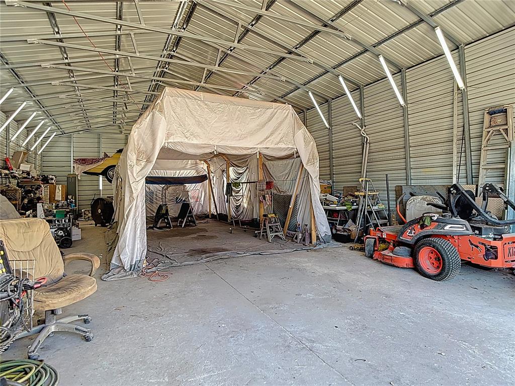 15821 Archer Street Hudson, FL 34667 - Photo 65 of 77 a view of a garage with parked cars