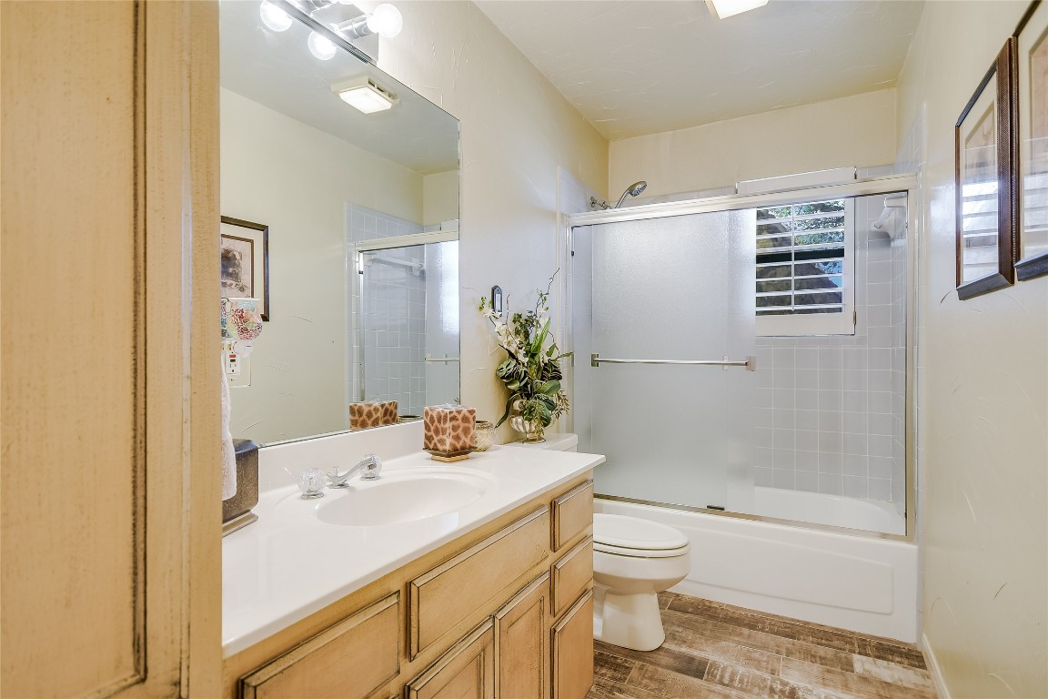 333 Quail Run Court Spicewood, TX 78669 - Photo 21 of 37 a bathroom with a sink toilet and shower