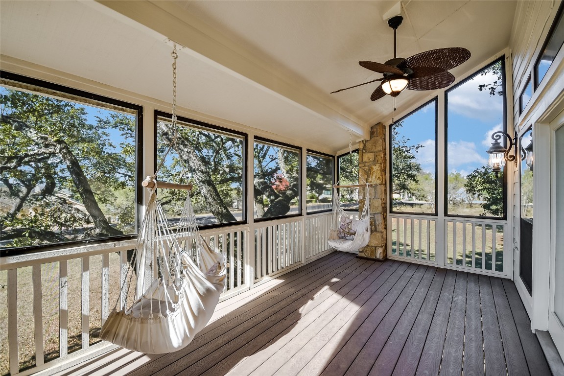 333 Quail Run Court Spicewood, TX 78669 - Photo 10 of 37 Escape the bugs, keep the breeze—this porch is a peaceful retreat right off the living room.