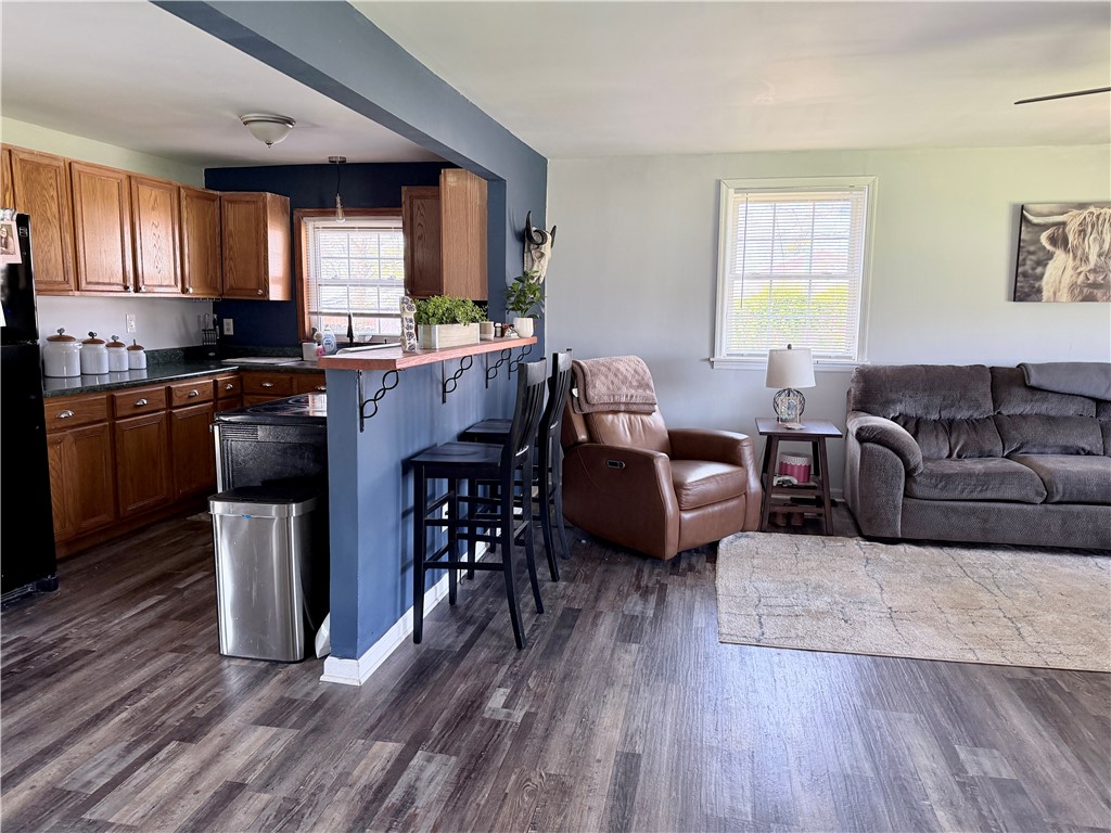 6800 Farmington Road Miamisburg, OH 45342 - Photo 6 of 32 This inviting space seamlessly blends kitchen functionality with comfortable living area warmth.