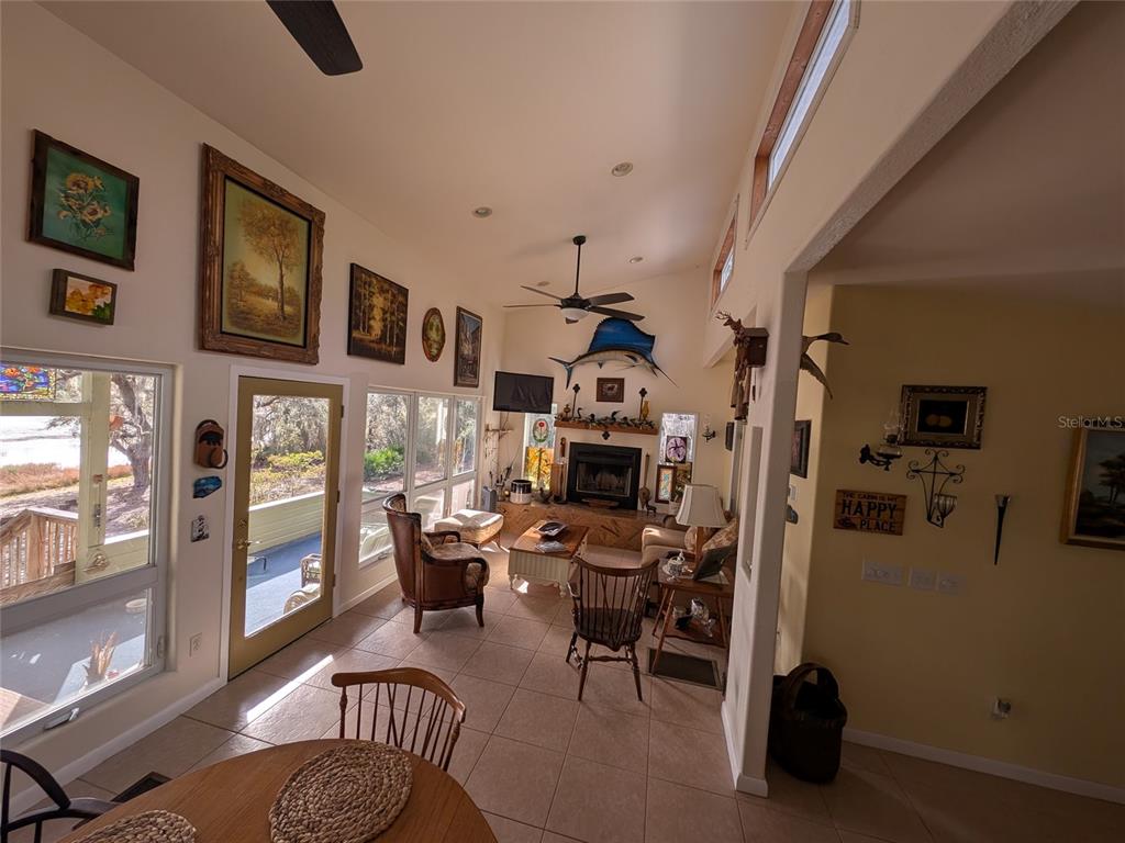 14730 Southeast 61st Street Road Ocklawaha, FL 32179 - Photo 17 of 88 a view of a livingroom with workspace and a window