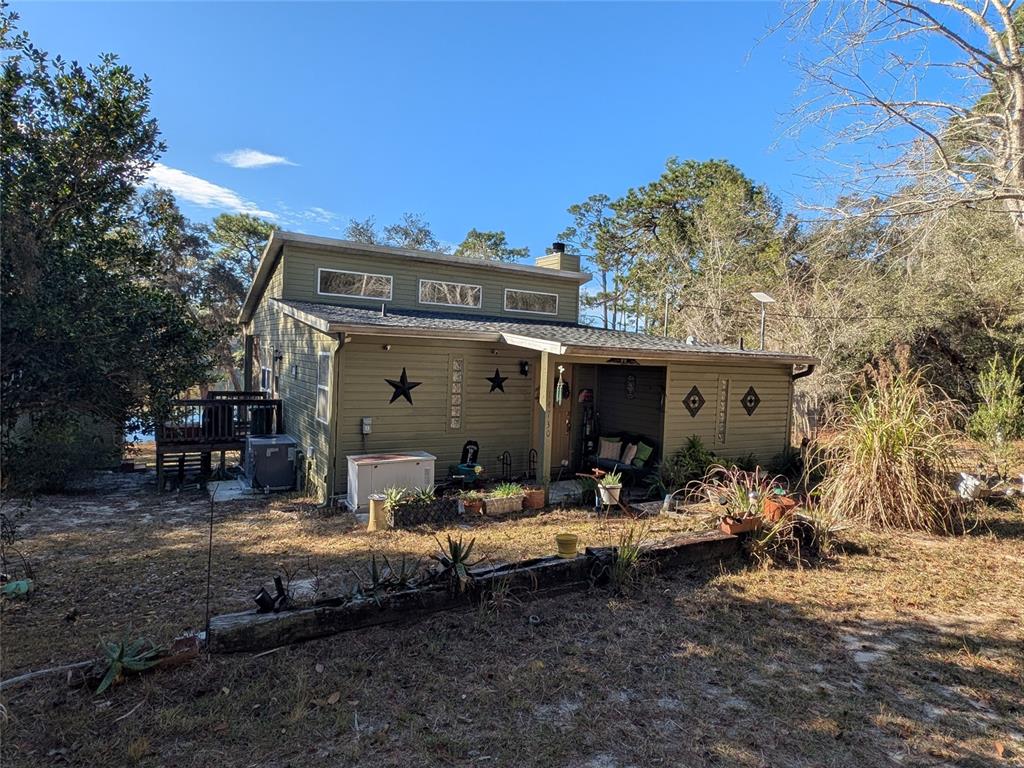 14730 Southeast 61st Street Road Ocklawaha, FL 32179 - Photo 2 of 88 a view of a house with backyard