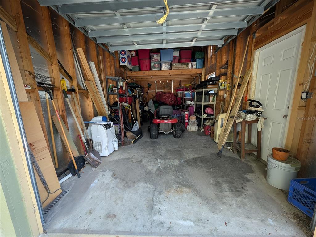 14730 Southeast 61st Street Road Ocklawaha, FL 32179 - Photo 52 of 88 a view of walk in closet with clothes and shoes