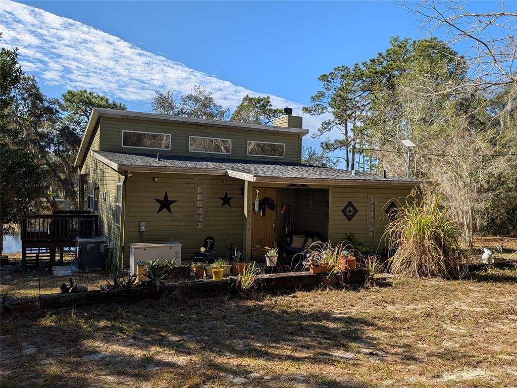 14730 Southeast 61st Street Road Ocklawaha, FL 32179 - Photo 53 of 88 a view of a house with patio