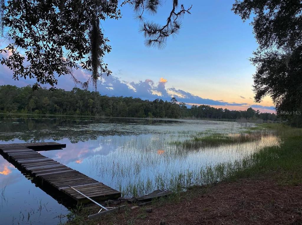 14730 Southeast 61st Street Road Ocklawaha, FL 32179 - Photo 62 of 88 a view of a lake with outdoor space