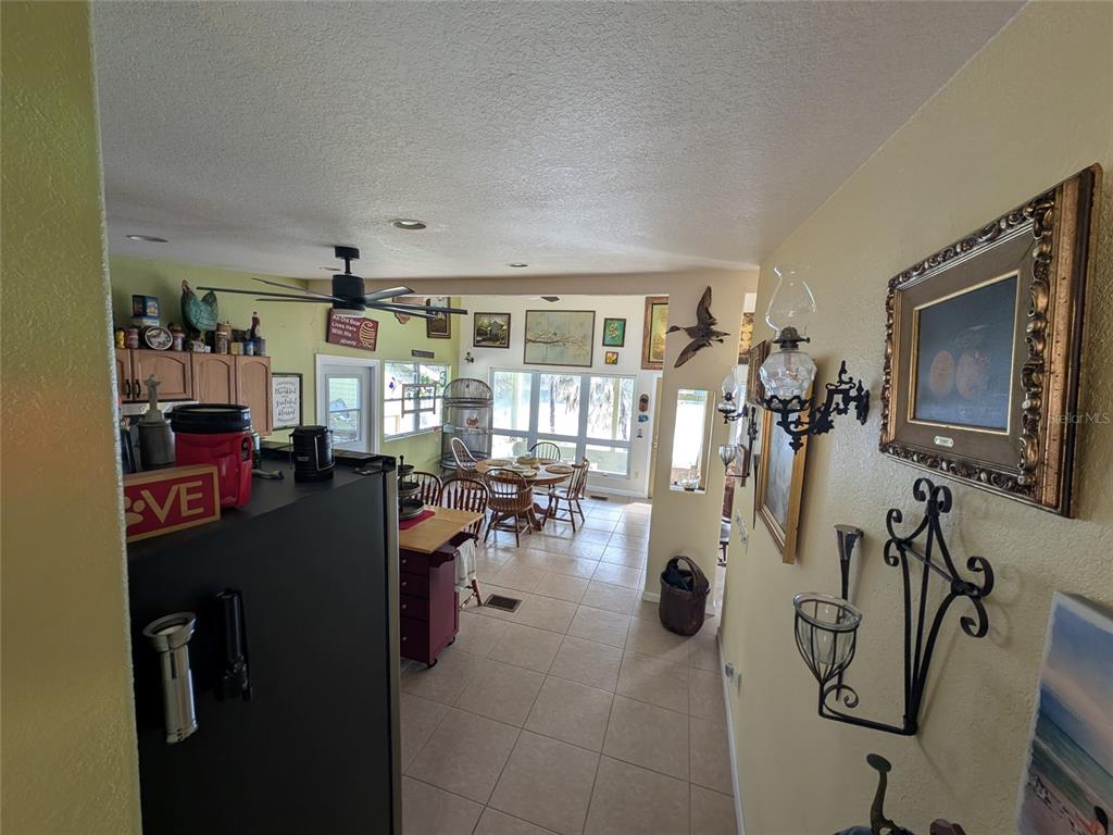 14730 Southeast 61st Street Road Ocklawaha, FL 32179 - Photo 8 of 88 a view of a livingroom with furniture and a flat screen tv