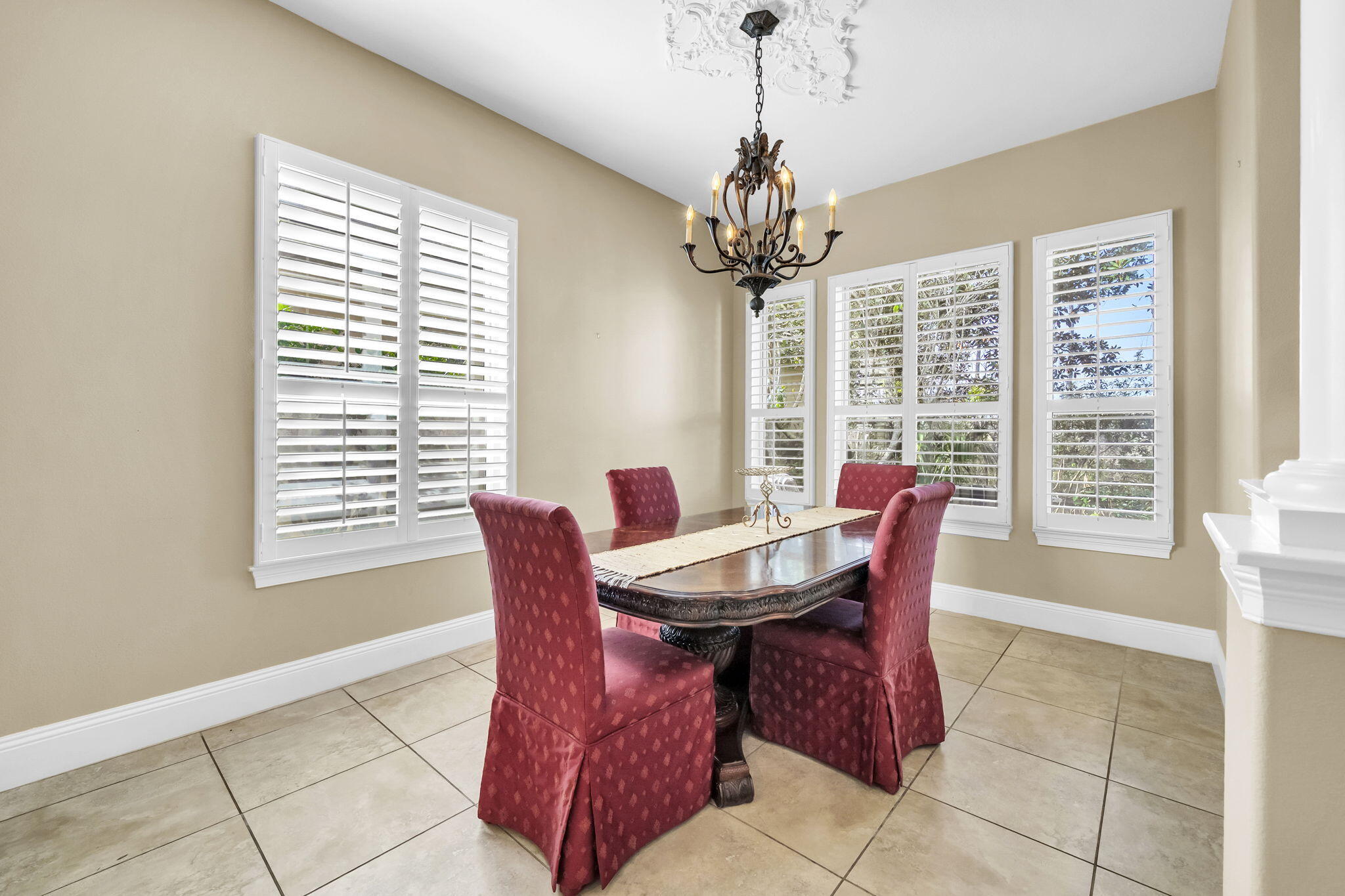 4595 Sailmaker Lane Destin, FL 32541 - Photo 12 of 50 a view of a dining room with furniture windows and wooden floor