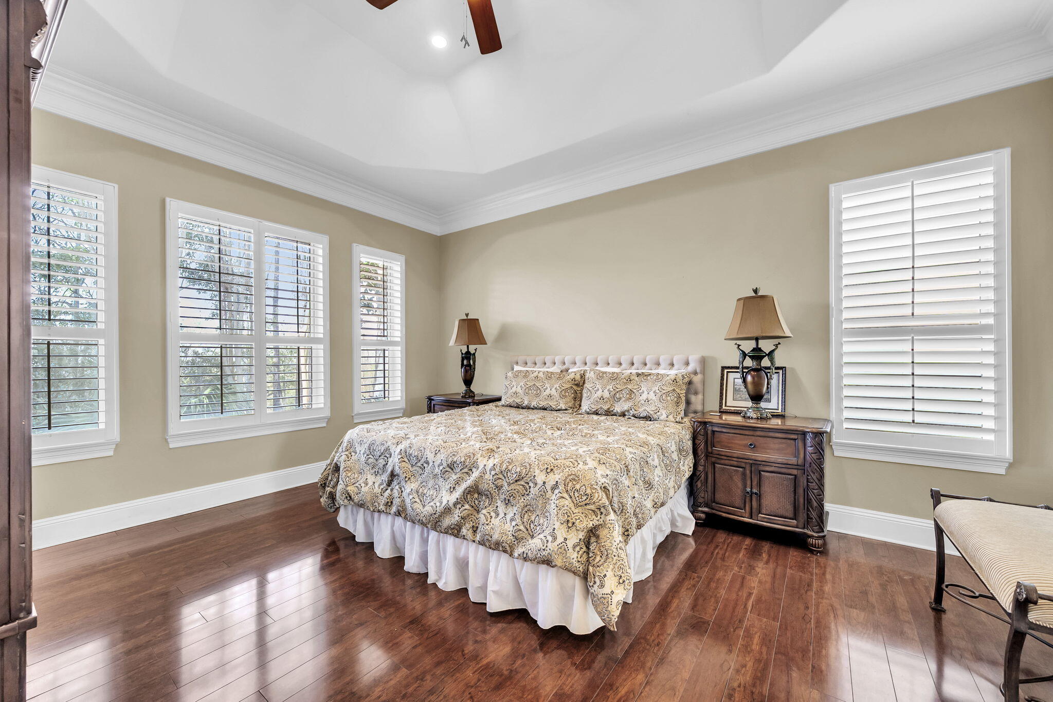 4595 Sailmaker Lane Destin, FL 32541 - Photo 19 of 50 a bedroom with a bed and a chair