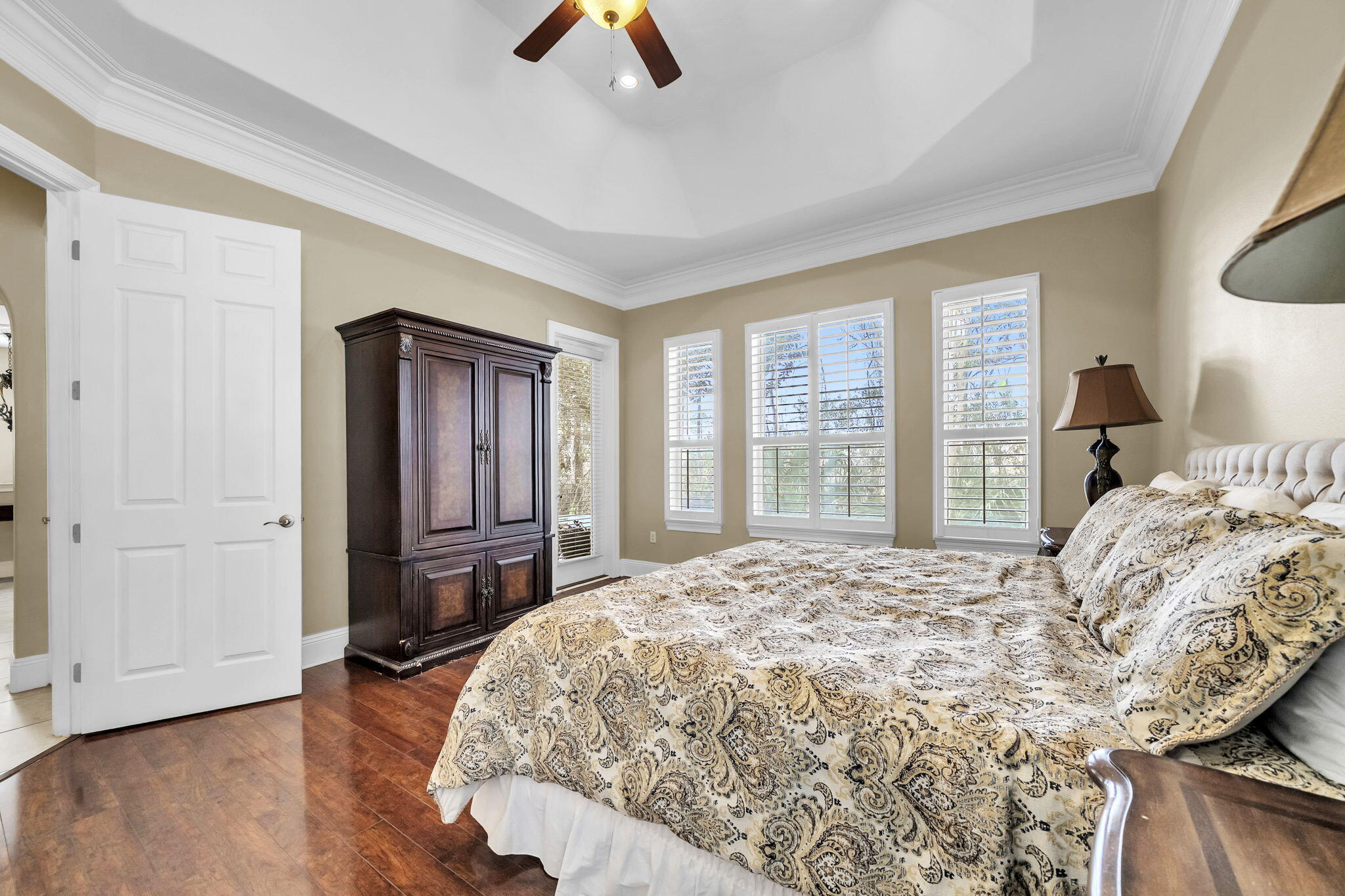 4595 Sailmaker Lane Destin, FL 32541 - Photo 20 of 50 a bed sitting in a bedroom next to a window