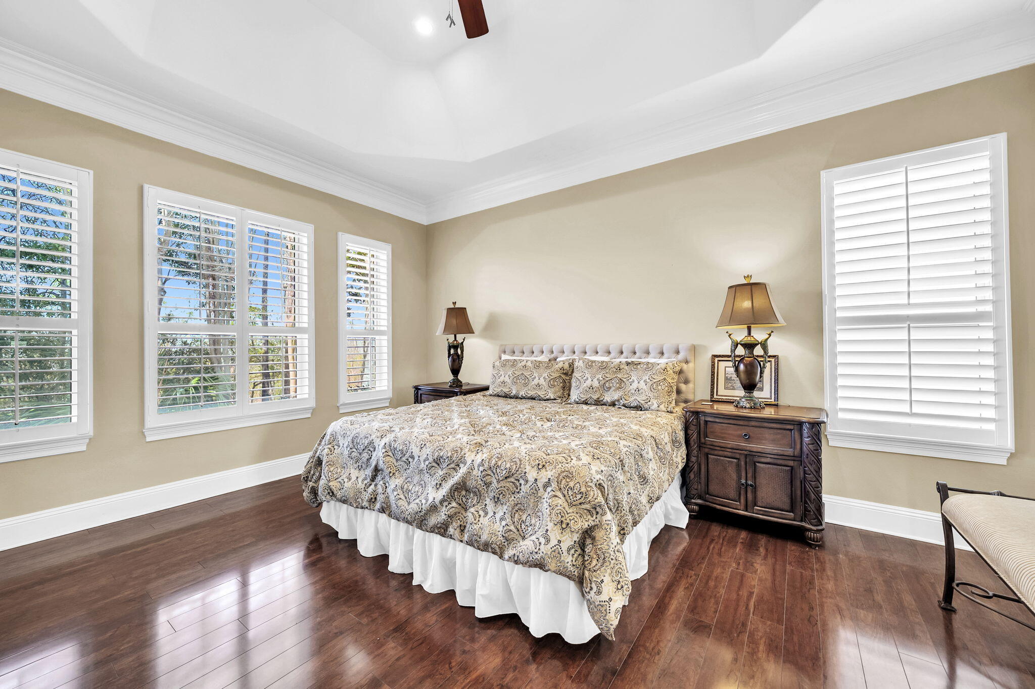 4595 Sailmaker Lane Destin, FL 32541 - Photo 21 of 50 a bedroom with a bed and wooden floor