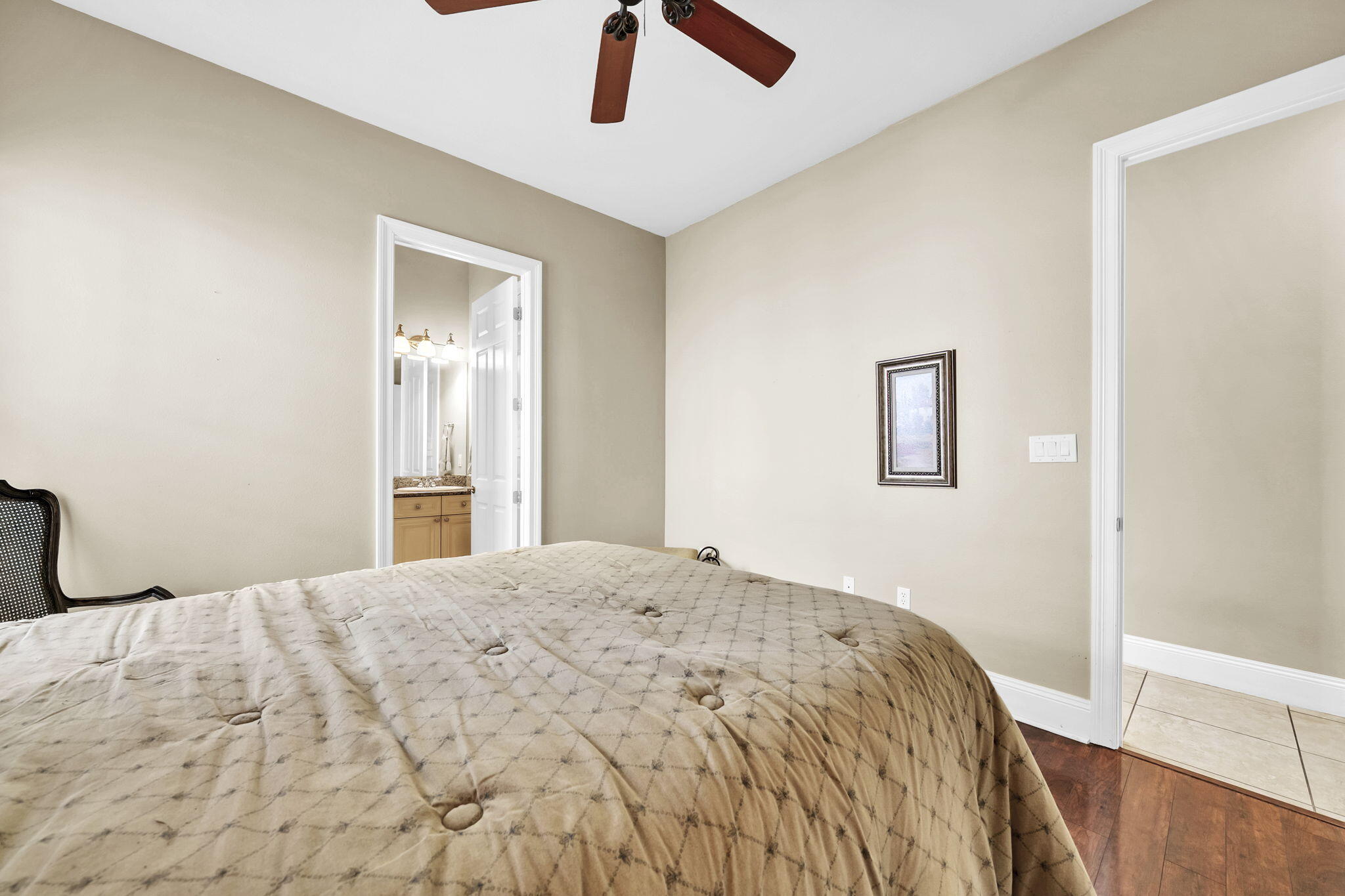 4595 Sailmaker Lane Destin, FL 32541 - Photo 31 of 50 a bedroom with a bed and a chandelier