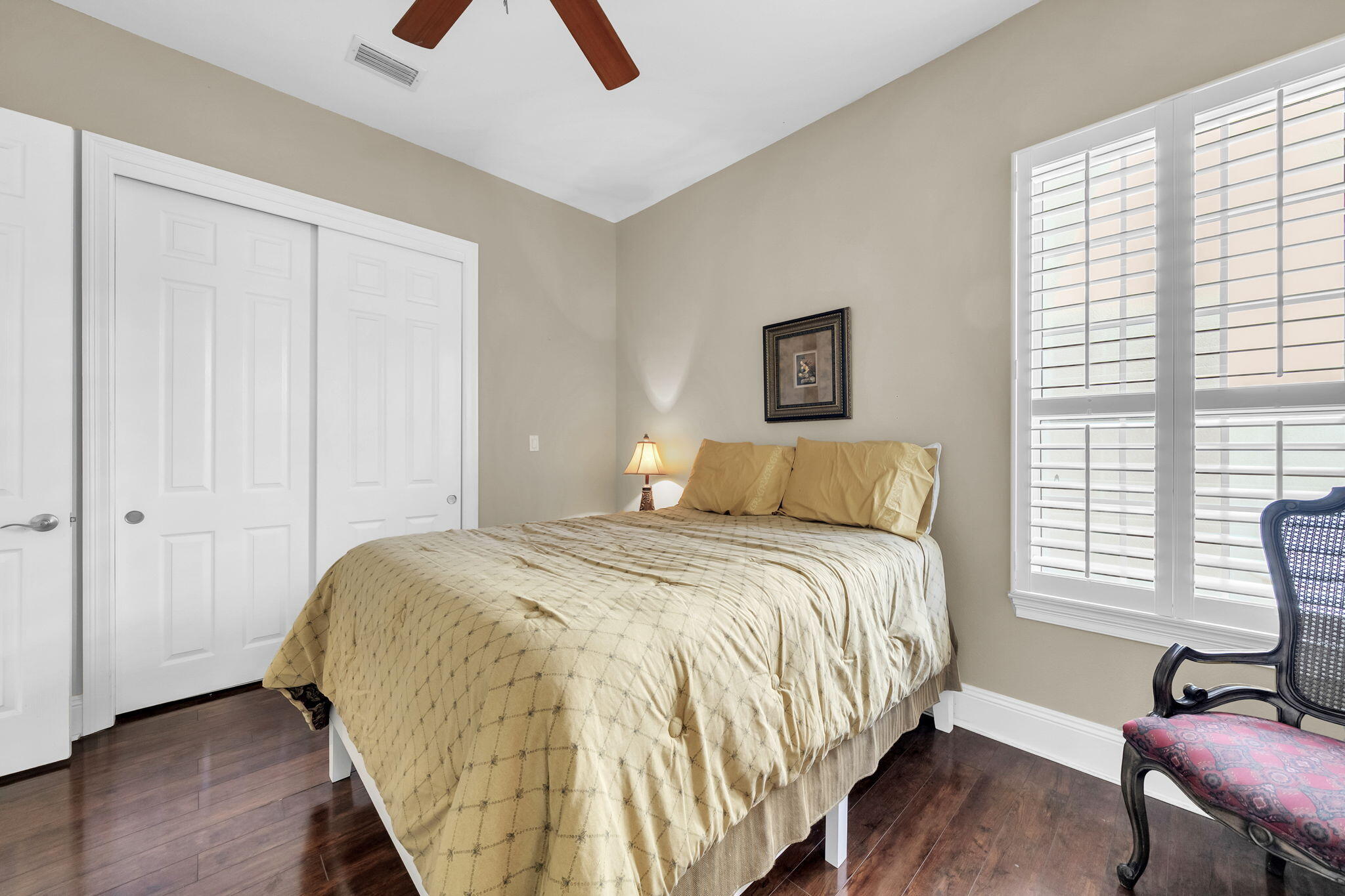 4595 Sailmaker Lane Destin, FL 32541 - Photo 32 of 50 a bed sitting in a bedroom next to a window