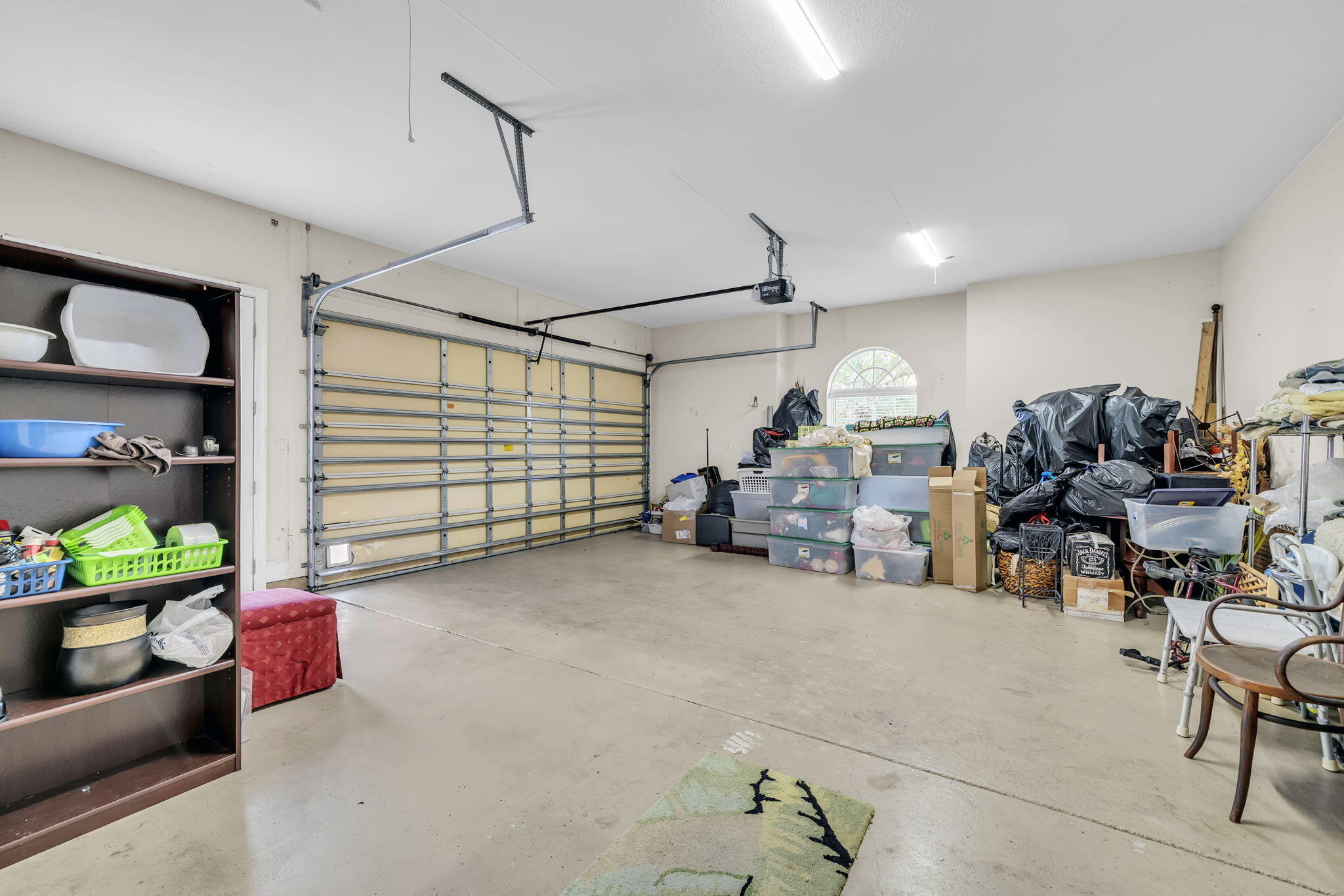 4595 Sailmaker Lane Destin, FL 32541 - Photo 48 of 50 a garage with a table and chairs