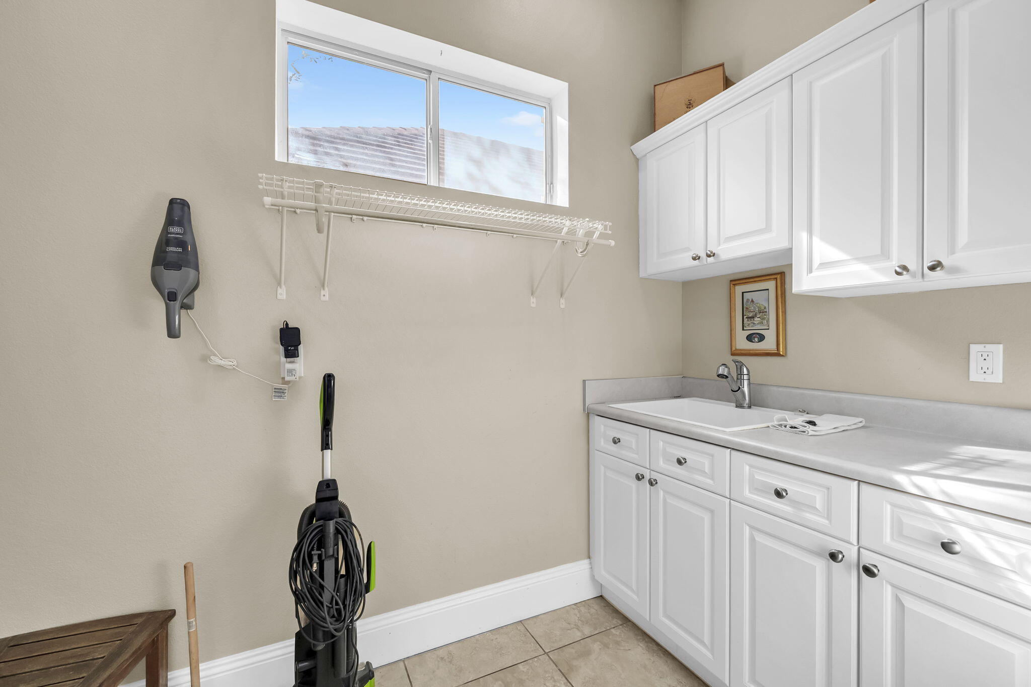4595 Sailmaker Lane Destin, FL 32541 - Photo 50 of 50 a kitchen with a sink and cabinets