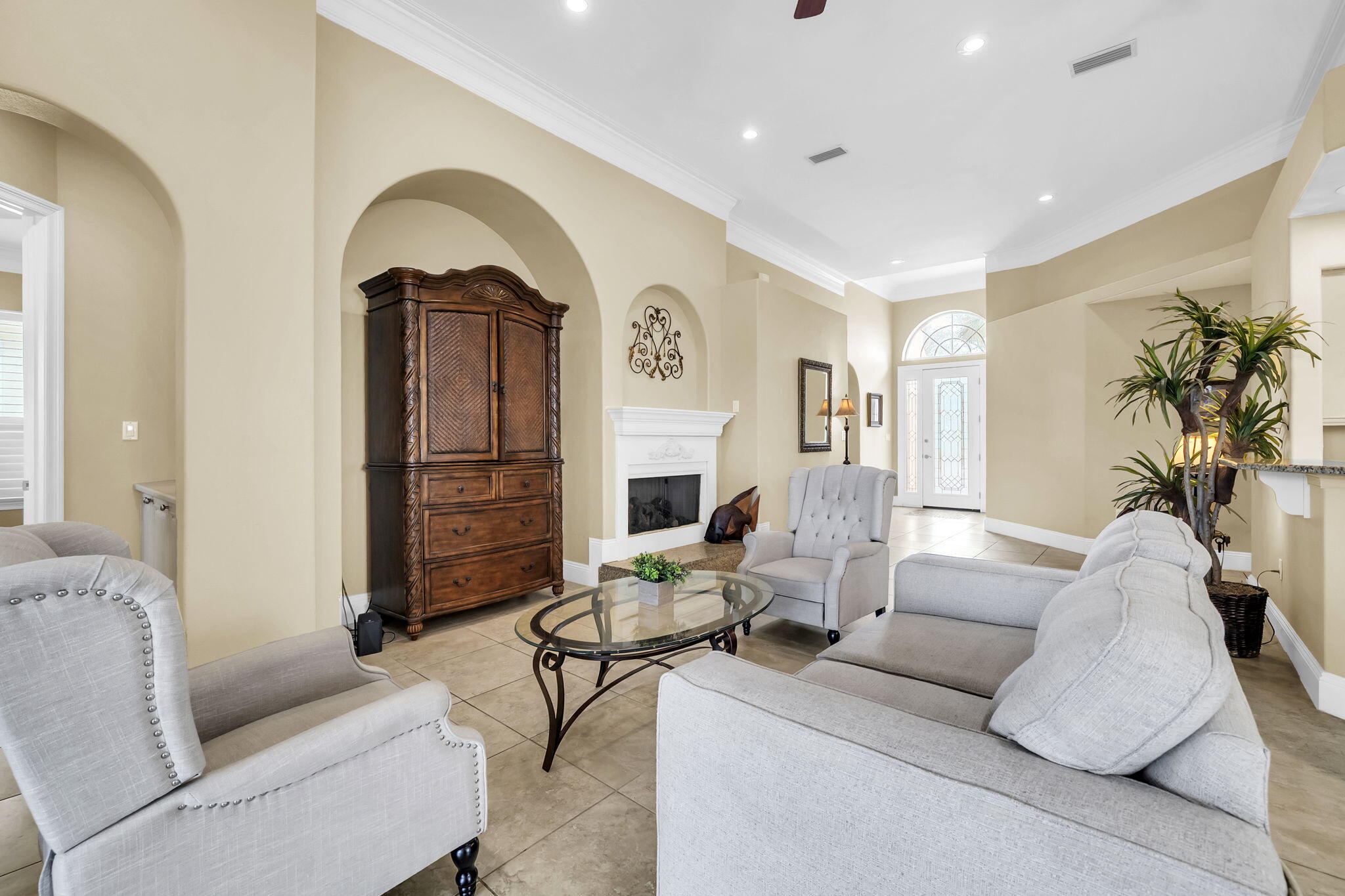 4595 Sailmaker Lane Destin, FL 32541 - Photo 7 of 50 a living room with furniture a fireplace and a potted plant