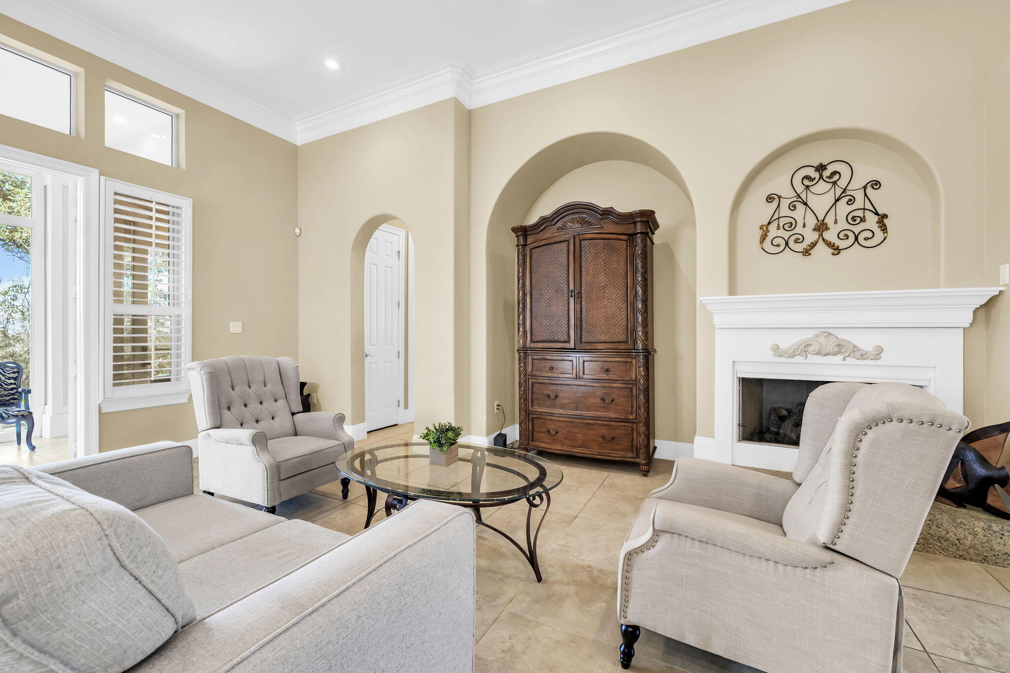 4595 Sailmaker Lane Destin, FL 32541 - Photo 9 of 50 a living room with furniture a fireplace and a large window
