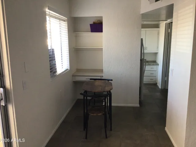 a room that has a window and chair in it