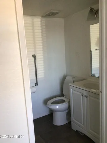 a bathroom with a toilet and a sink