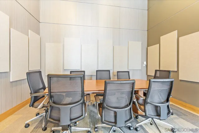 a view of a workspace with furniture and sitting area