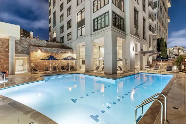 a view of swimming pool with outdoor seating