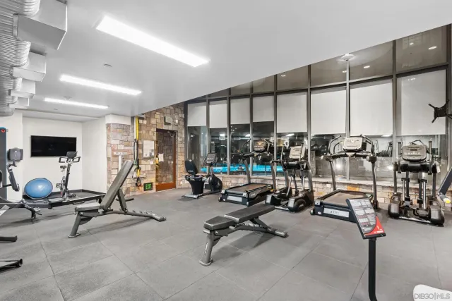 a living room with lots of furniture and outdoor space