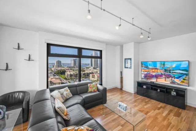 a living room with furniture and a flat screen tv