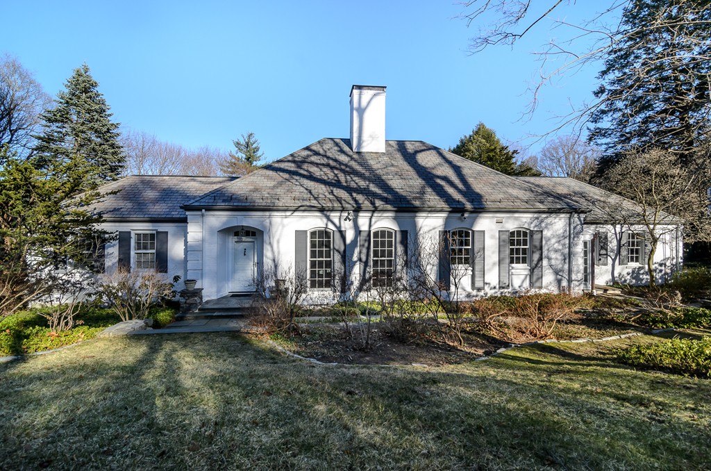 21 Carisbrooke Road Wellesley, MA 02481 - Photo 1 of 18 a front view of a house with a garden