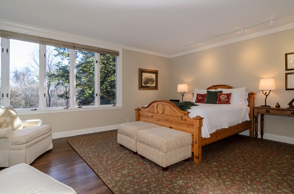 21 Carisbrooke Road Wellesley, MA 02481 - Photo 14 of 18 a bedroom with a bed and a couch next to a window