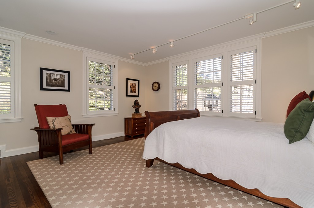 21 Carisbrooke Road Wellesley, MA 02481 - Photo 15 of 18 a spacious bedroom with a bed a couch and a large window