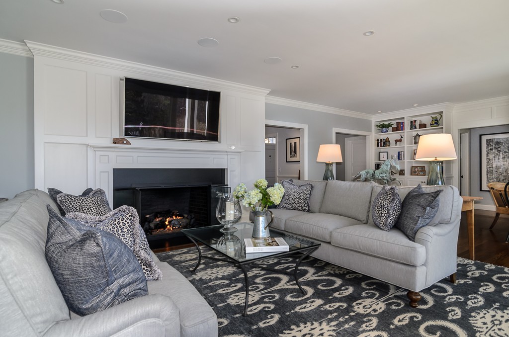 21 Carisbrooke Road Wellesley, MA 02481 - Photo 9 of 18 a living room with furniture a flat screen tv and a fireplace