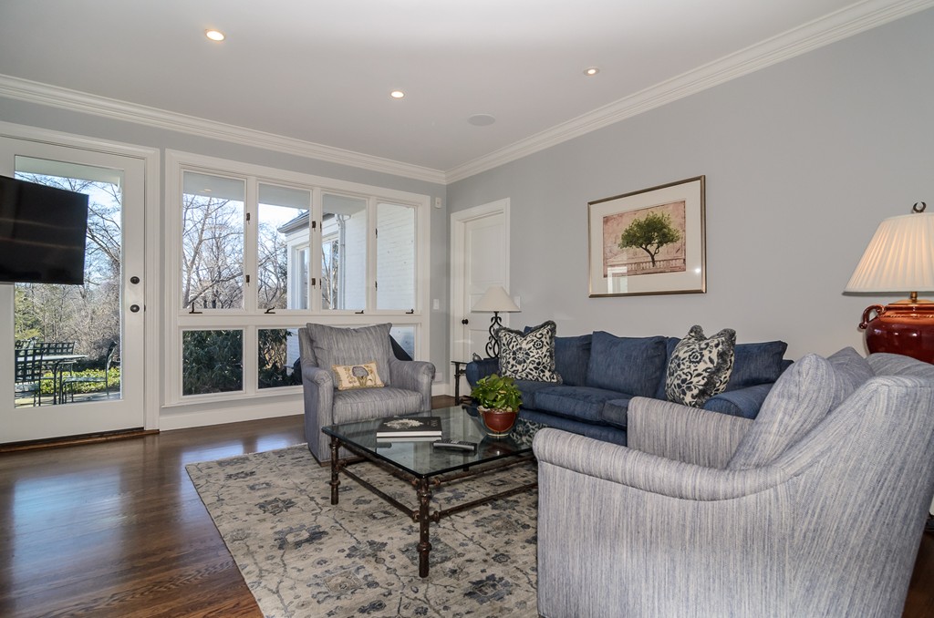 21 Carisbrooke Road Wellesley, MA 02481 - Photo 10 of 18 a living room with furniture a flat screen tv and a large window