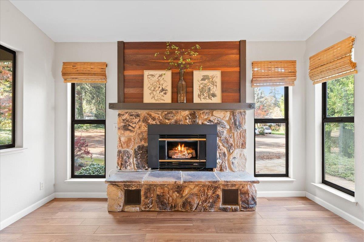 561 Blight Road Grass Valley, CA 95945 - Photo 11 of 44 a living room with a fireplace and windows