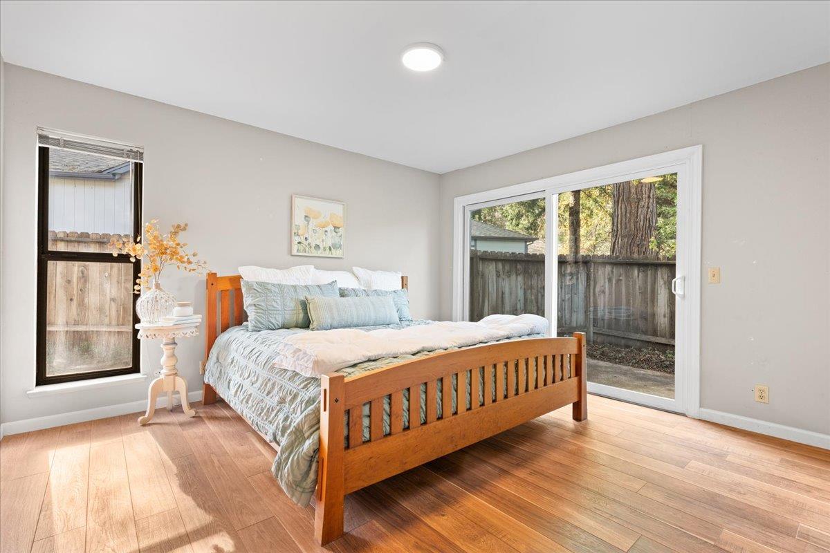 561 Blight Road Grass Valley, CA 95945 - Photo 16 of 44 a bedroom with a large bed and a window