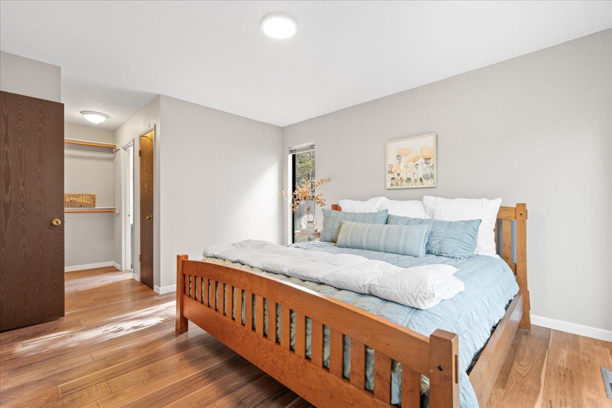 561 Blight Road Grass Valley, CA 95945 - Photo 17 of 44 a large bedroom with a bed and wooden floor