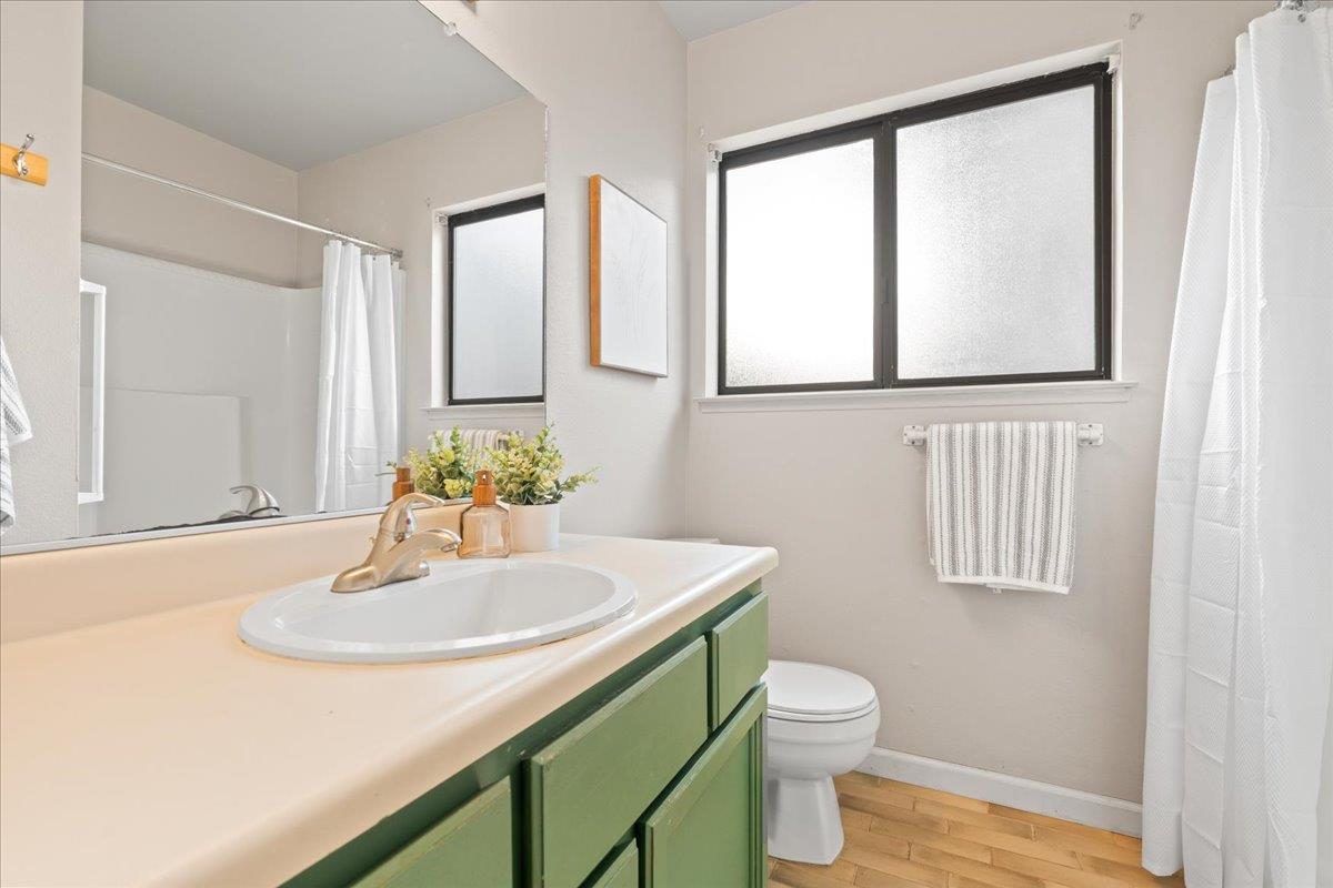 561 Blight Road Grass Valley, CA 95945 - Photo 19 of 44 a bathroom with a sink a toilet and mirror