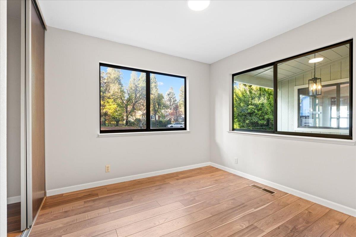 561 Blight Road Grass Valley, CA 95945 - Photo 22 of 44 a view of an empty room with wooden floor and a window