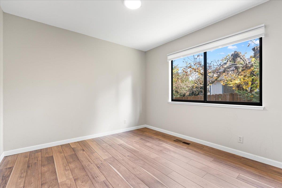 561 Blight Road Grass Valley, CA 95945 - Photo 25 of 44 a view of empty room with wooden floor and fan