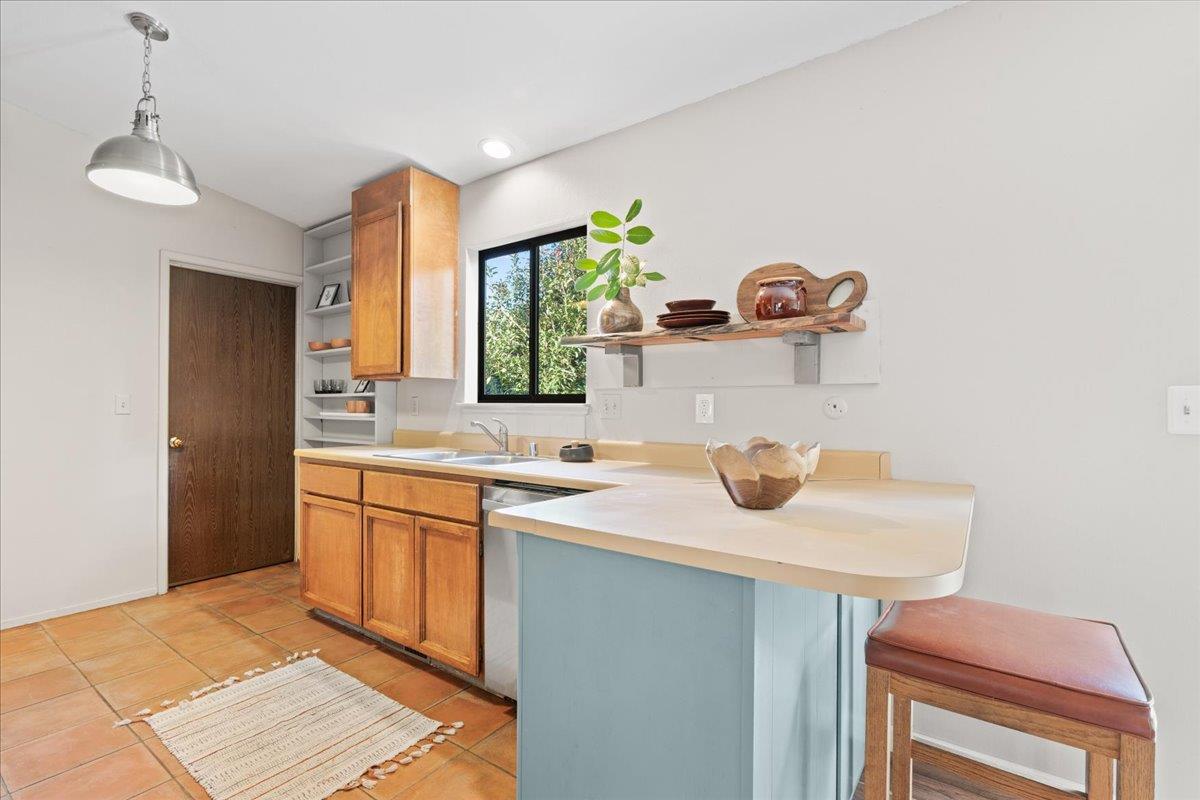 561 Blight Road Grass Valley, CA 95945 - Photo 5 of 44 a kitchen with a sink and a refrigerator