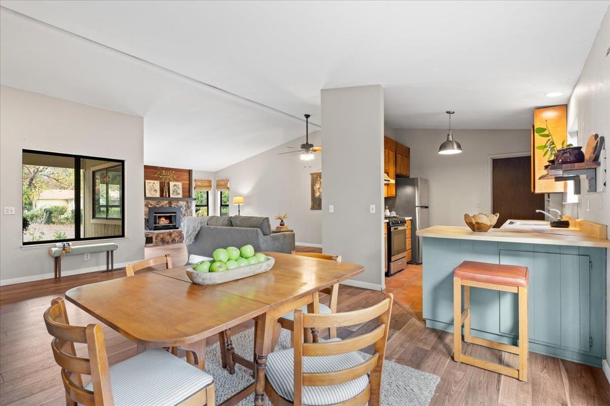 561 Blight Road Grass Valley, CA 95945 - Photo 6 of 44 a view of a dining room with furniture and wooden floor