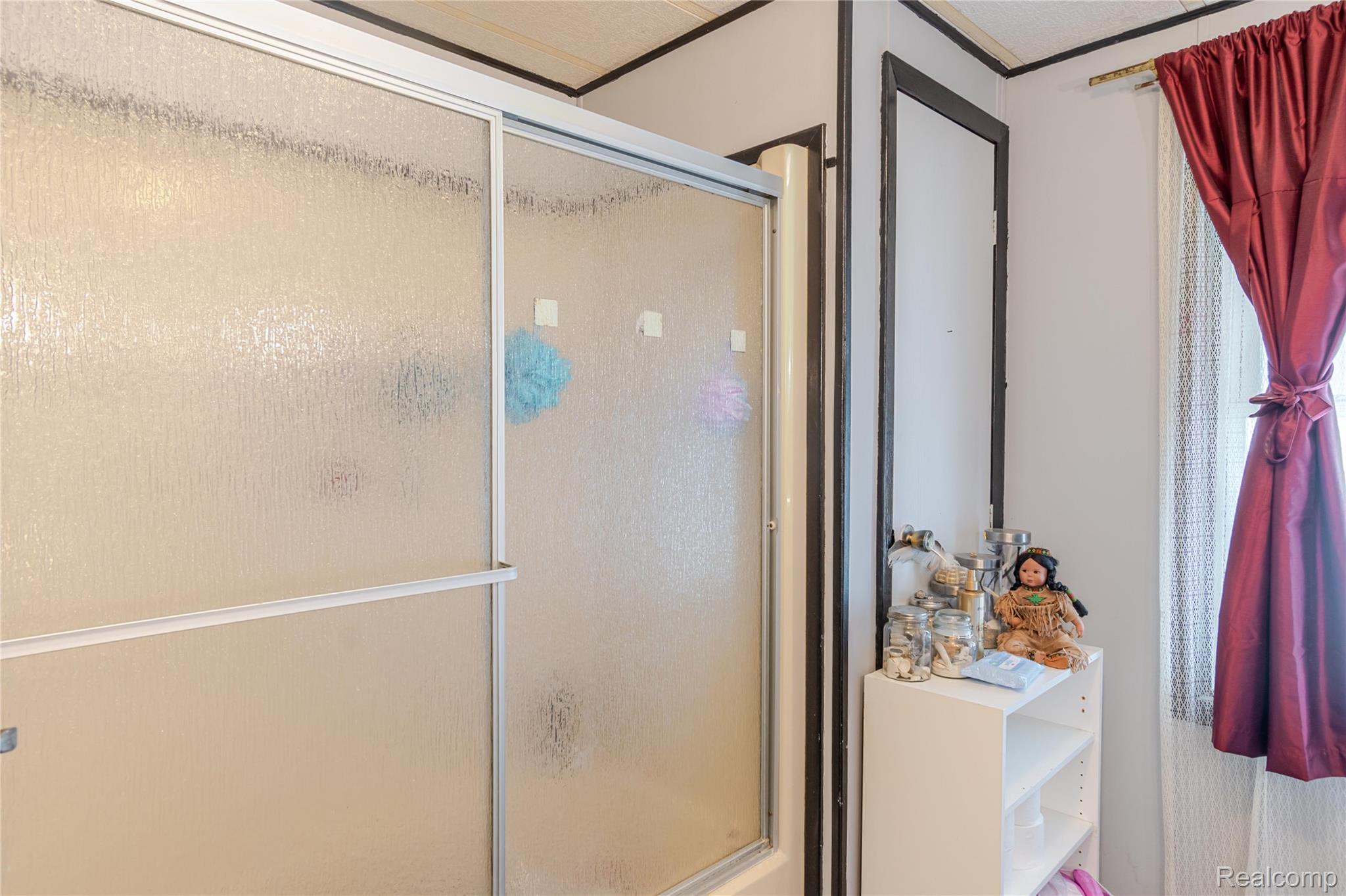 6655 Jackson Road, Unit 126 Ann Arbor, MI 48103 - Photo 23 of 36 Full bathroom featuring a shower stall