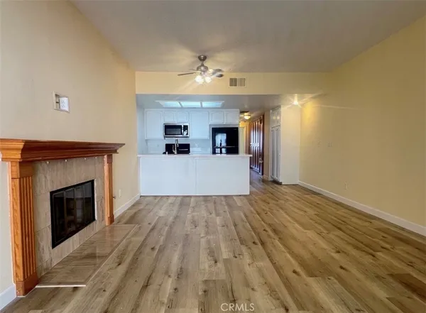 wooden floor fireplace and natural light