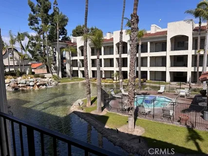 a view of a swimming pool with outdoor seating