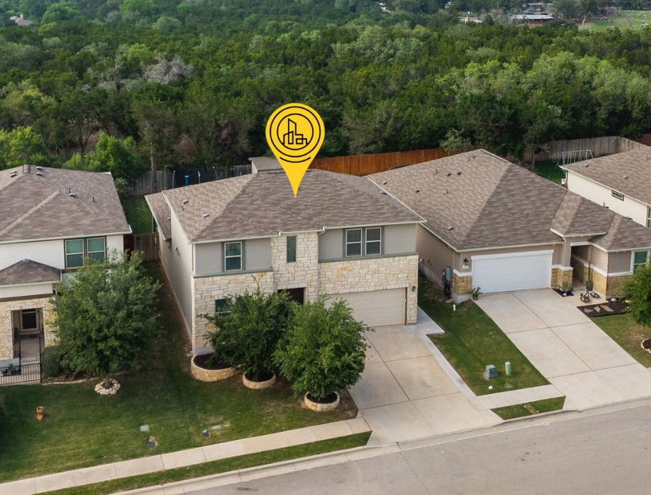 409 Limestone Road Liberty Hill, TX 78642 - Photo 1 of 35 an aerial view of a house with swimming pool and patio
