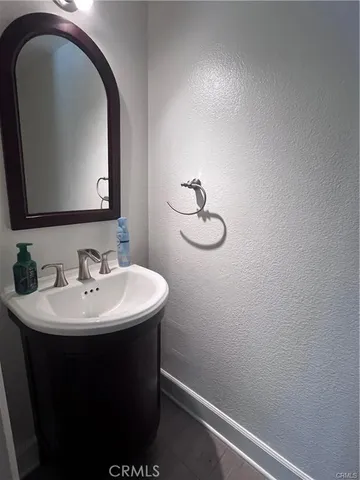 a bathroom with a sink and mirror