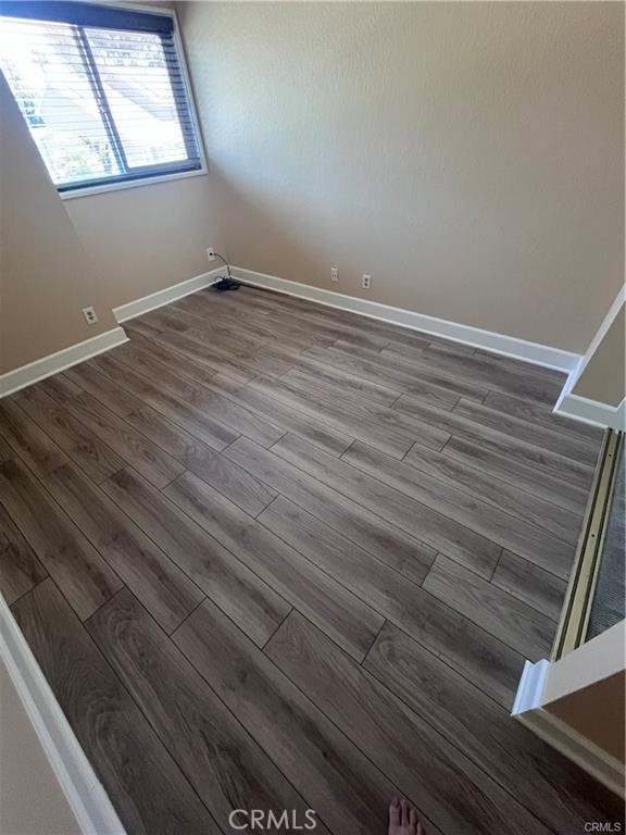 21681 Cabrosa Mission Viejo, CA 92691 - Photo 19 of 22 a view of an empty room with wooden floor and a window